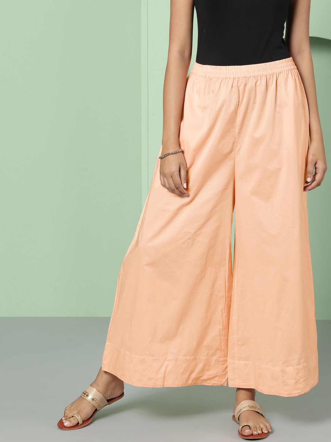 House of Pataudi Women Peach-Coloured Solid Flared Palazzos